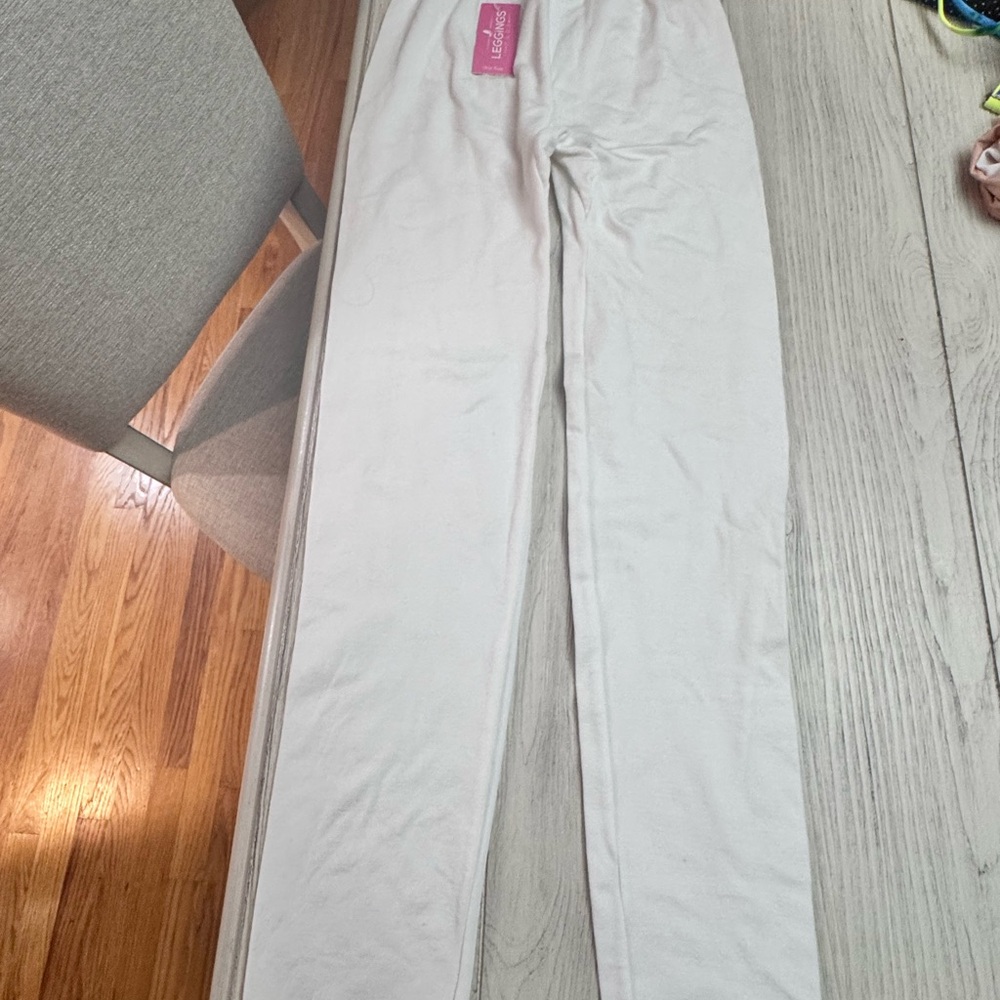 White Leggings with Pink Brand Tag